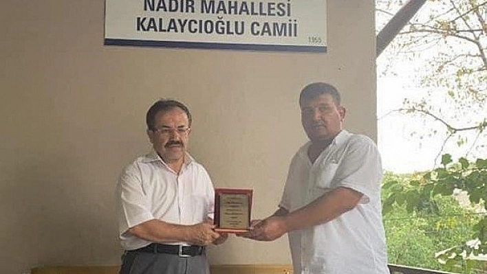 Din görevlisine plaketli uğurlama